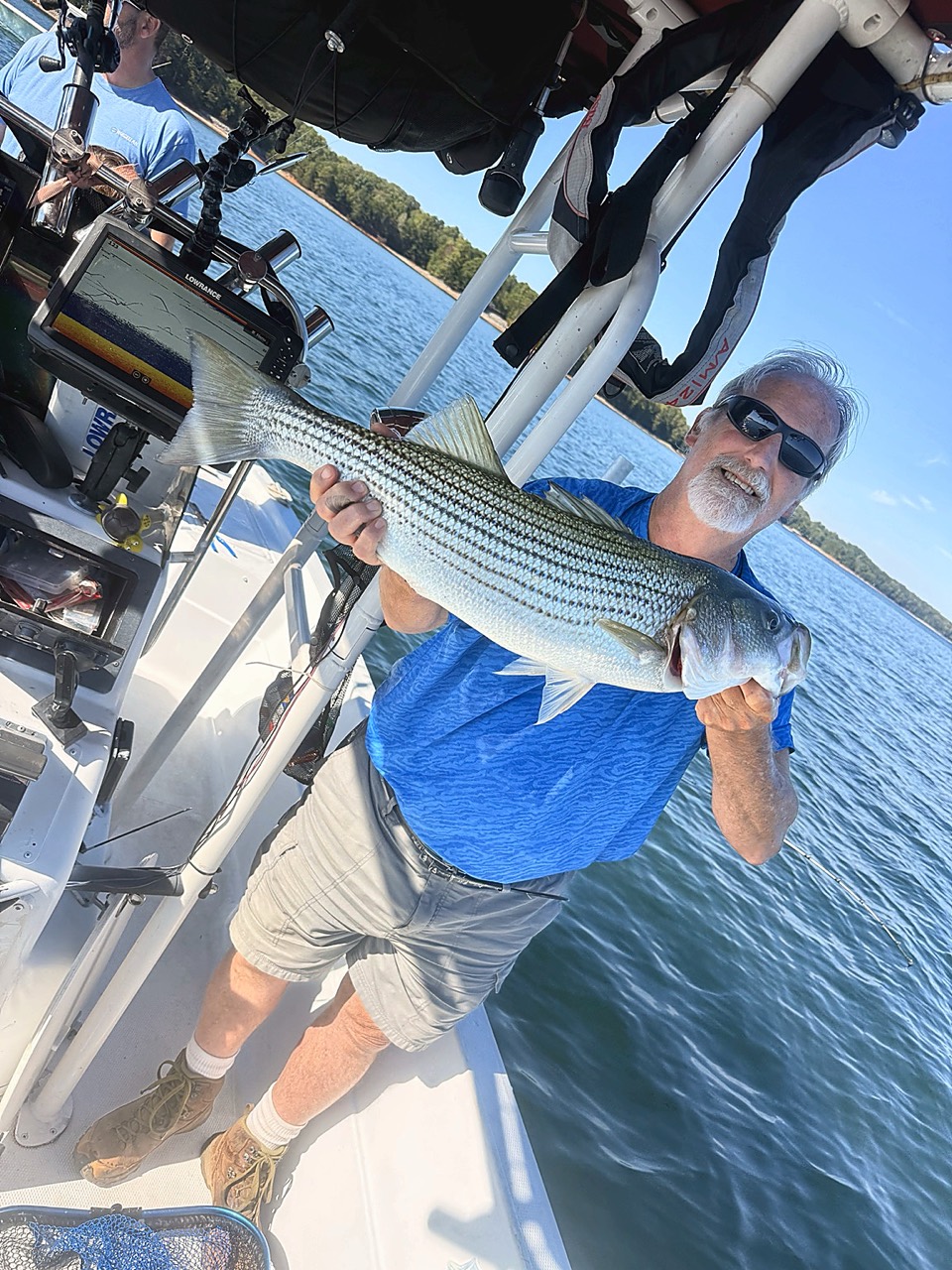 Lake Lanier Striper Fishing Report – October 12, 2026 Longtime client holding a quality Lake Lanier striped bass