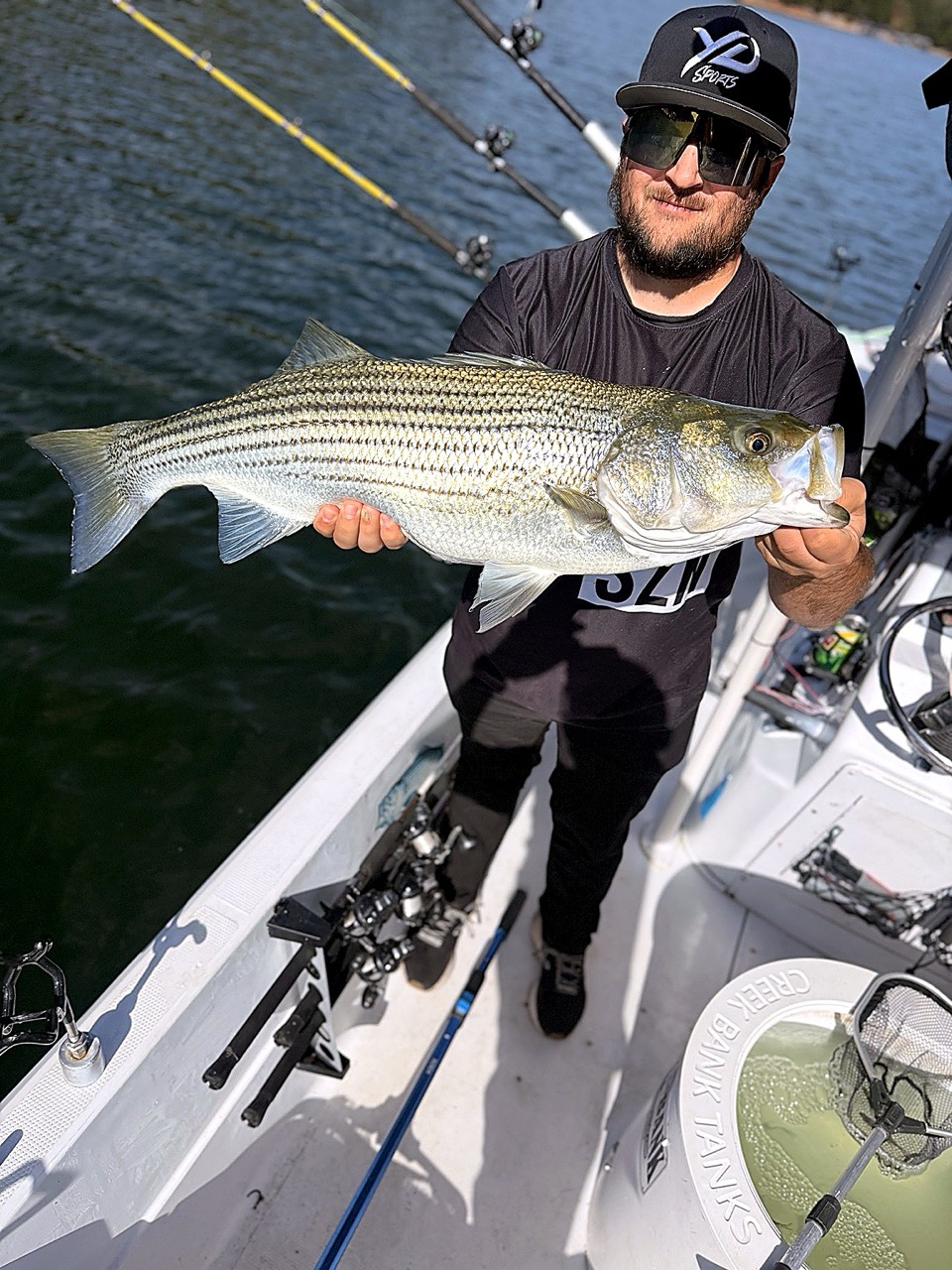 Lake Lanier Striper Fishing Report – October 20, 2026 Michael from Maryland holding his Lake Lanier striped bass