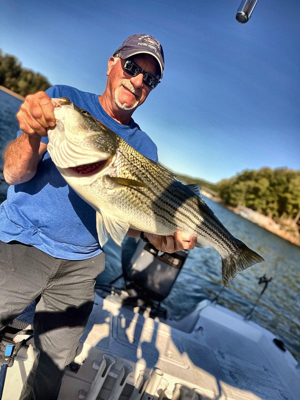 Lake Lanier Striper Fishing Report – October 22, 2026 Donald displaying a quality Lake Lanier striper caught with live bait
