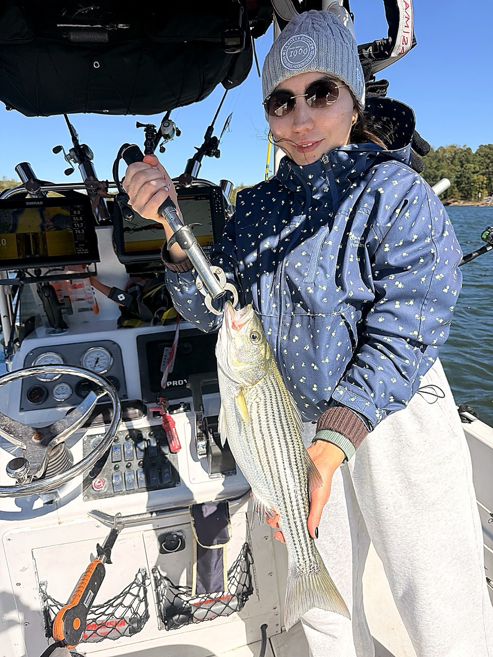 Lake Lanier Striper Fishing Report – October 19, 2026 Angler holding a striped bass during a fall Lake Lanier charter